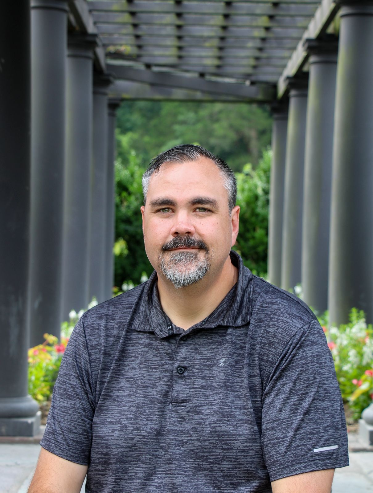 Professional headshot with clean background